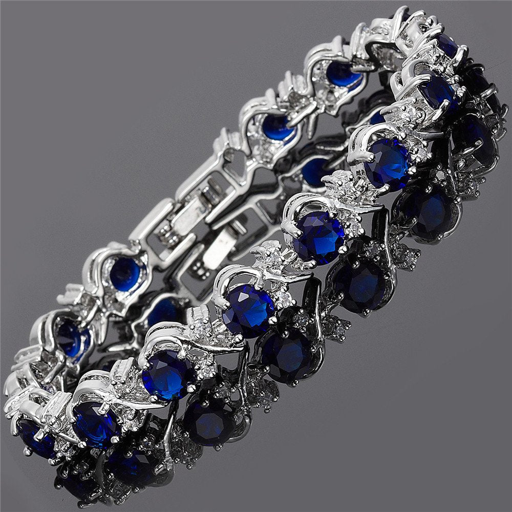 RIZILIA BLOSSOM Blue Sapphire CZ 18K White Gold Plated Tennis Bracelet
