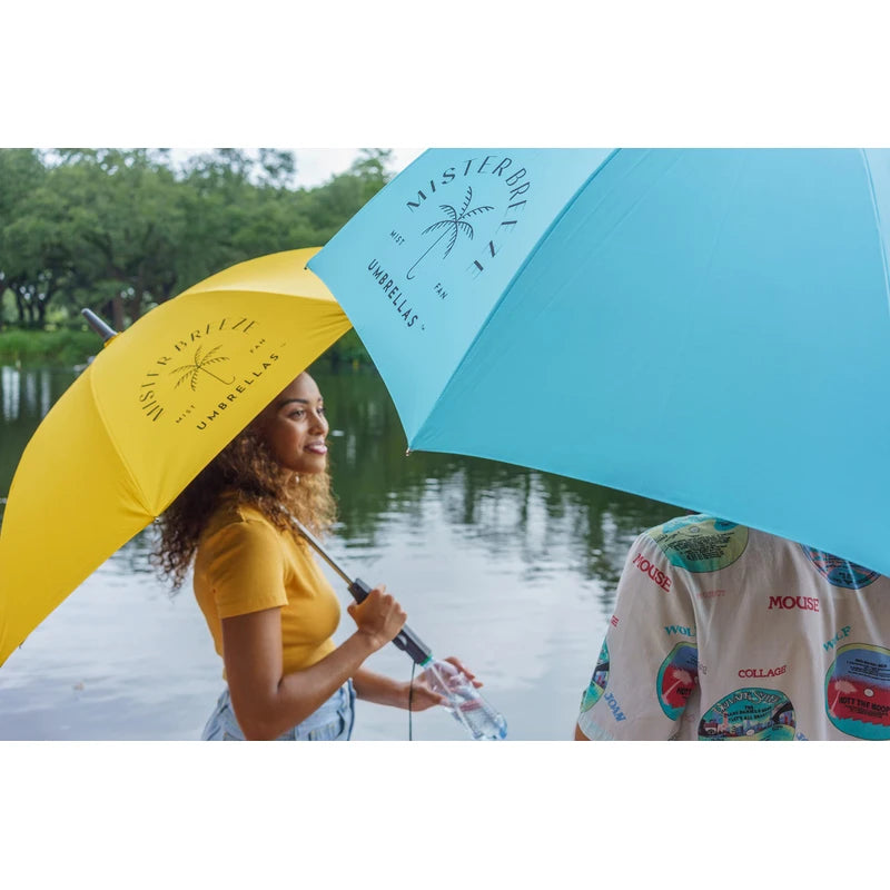 MISTERBREEZE Gray Umbrella with Fan and Mister. A portable misting fan that blocks 99.9% of all UVA and UVB rays. Personal outdoor sun protection at festivals, beach, golf or other sports activities.