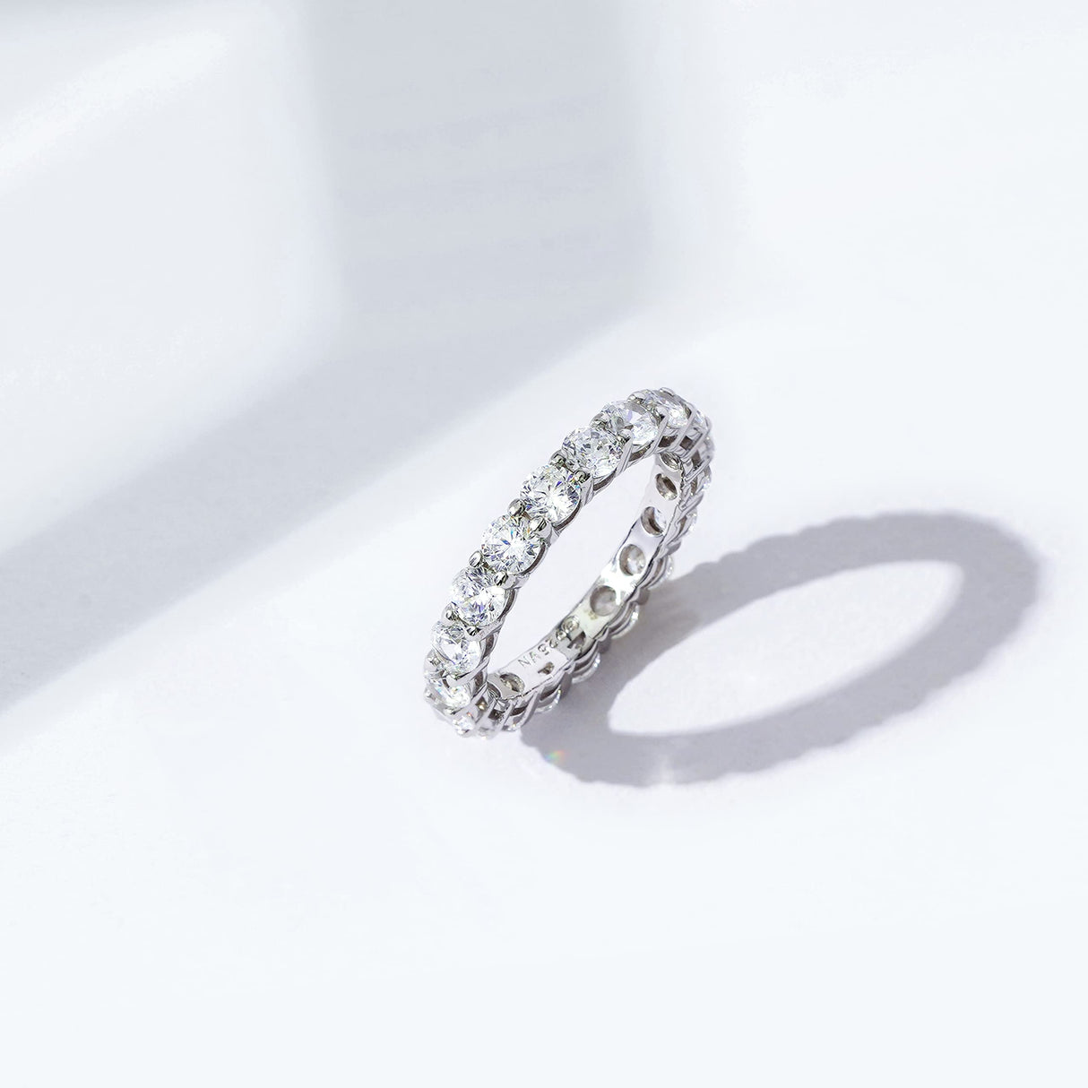 Amazon Essentials Platinum-Plated Sterling Silver Infinite Elements Cubic Zirconia (3 cttw) All-Around Ring, Size 5