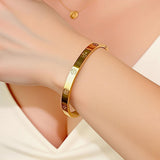 LUCSIS Waterproof 18K Gold PVD Plated Bangle Bracelet for Women, Stainless Steel Bracelet Non Tarnish with Cross Pattern Engraved and 5A Grade Cubic Zirconia, Trendy Fashion Jewelry Gift