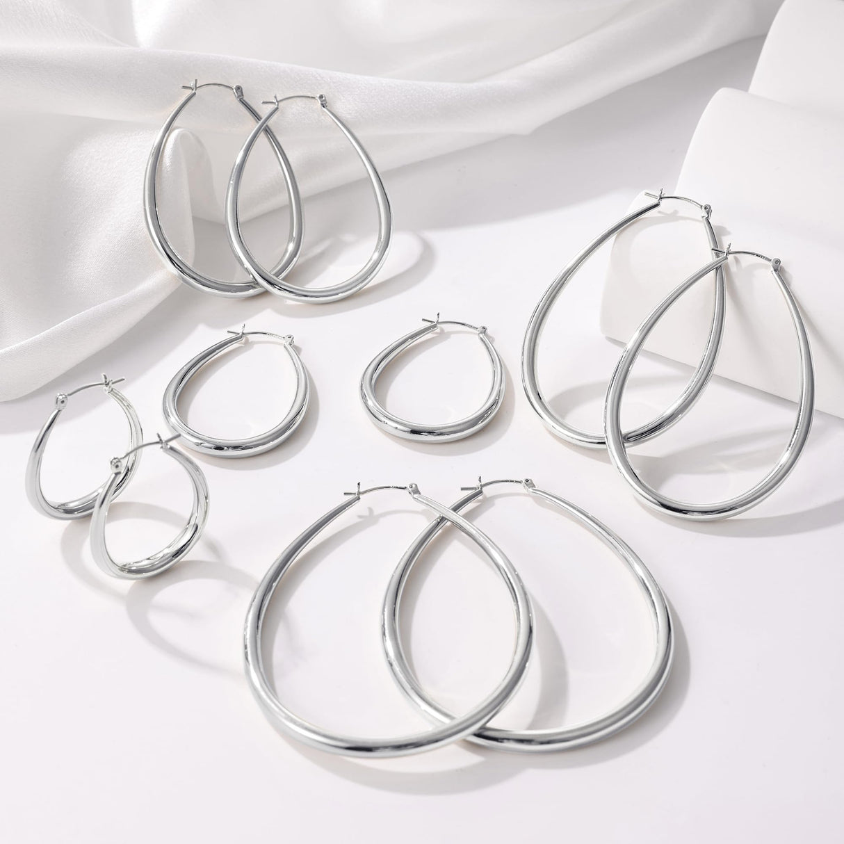 Gacimy Silver Chunky Hoop Earrings for Women, 14K White Gold Plated Oval Hoop Medium Silver Earrings with 925 Sterling Silver Post