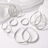 Gacimy Silver Chunky Hoop Earrings for Women, 14K White Gold Plated Oval Hoop Medium Silver Earrings with 925 Sterling Silver Post