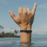 Rowdy Parrot FlexTech™ Adjustable Silicone Braided Rope Bracelet for Men - Waterproof, Sweatproof, One Size Fits All - Featuring Religious Christian Jesus Cross Design (Black Sand | Black Lagoon)