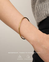 PAVOI Waterproof Bangle Bracelet for Women | 14K Yellow Gold Plated Classic Lightweight Stacking Stainless Steel Bracelet | Small/Medium Size