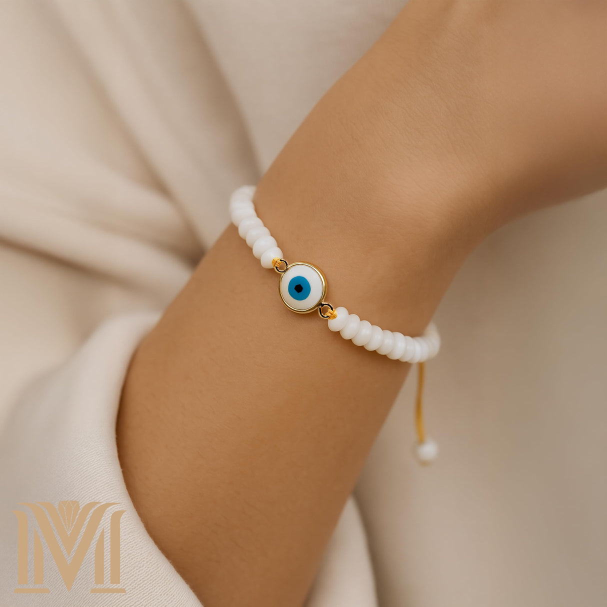 Mana Gallery Handmade Evil Eye Bracelet – White Mother of Pearl Beads with Gold-Plated Blue Eye Charm – Adjustable Macramé Cord – Protective Jewelry Gift for Women (Evil Eye Bracelet)