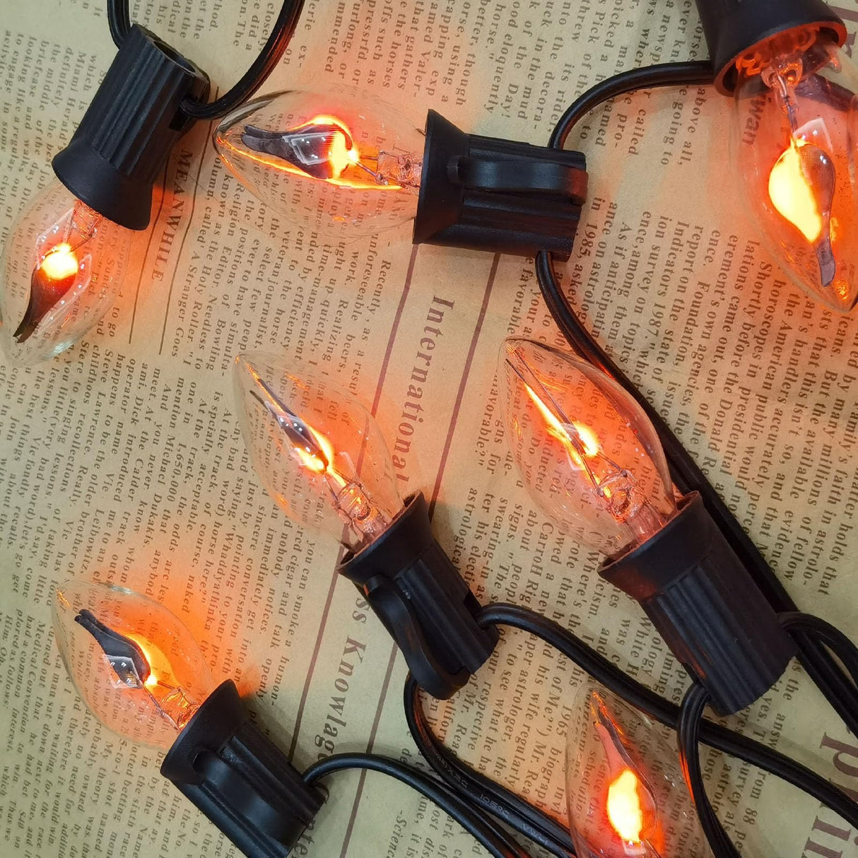 C7 Halloween Flicker Flame String Lights, 25Ft C7 Outdoor Christmas Decorations String Lights with C7 Clear Flicker Flame Bulbs, Hanging Patio Lights for Christmas Halloween Party Garden Porch-Black